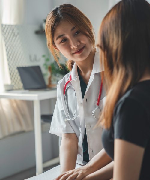 Close up hands Woman doctor holding hands patient encourage cheer up a consultation at hospital medicare clinic. Doctor talking to patient support giving hope mental health therapy consoling recovery